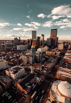 aerial view of denver city buildings during sundown