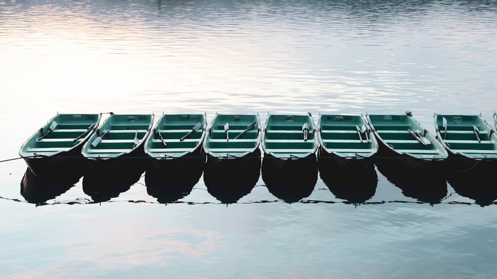 black and white boat on body of water during daytime