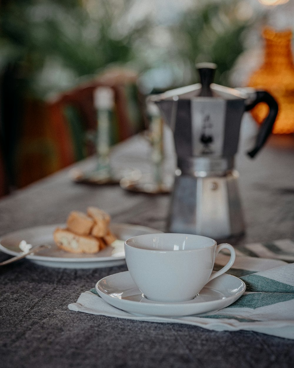 white ceramic teacup on white ceramic saucer