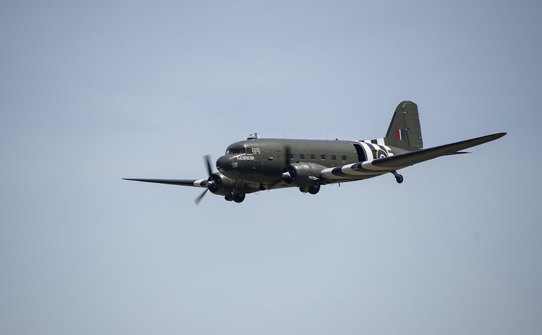 gray and black jet plane in mid air, dehavilland dakota uk