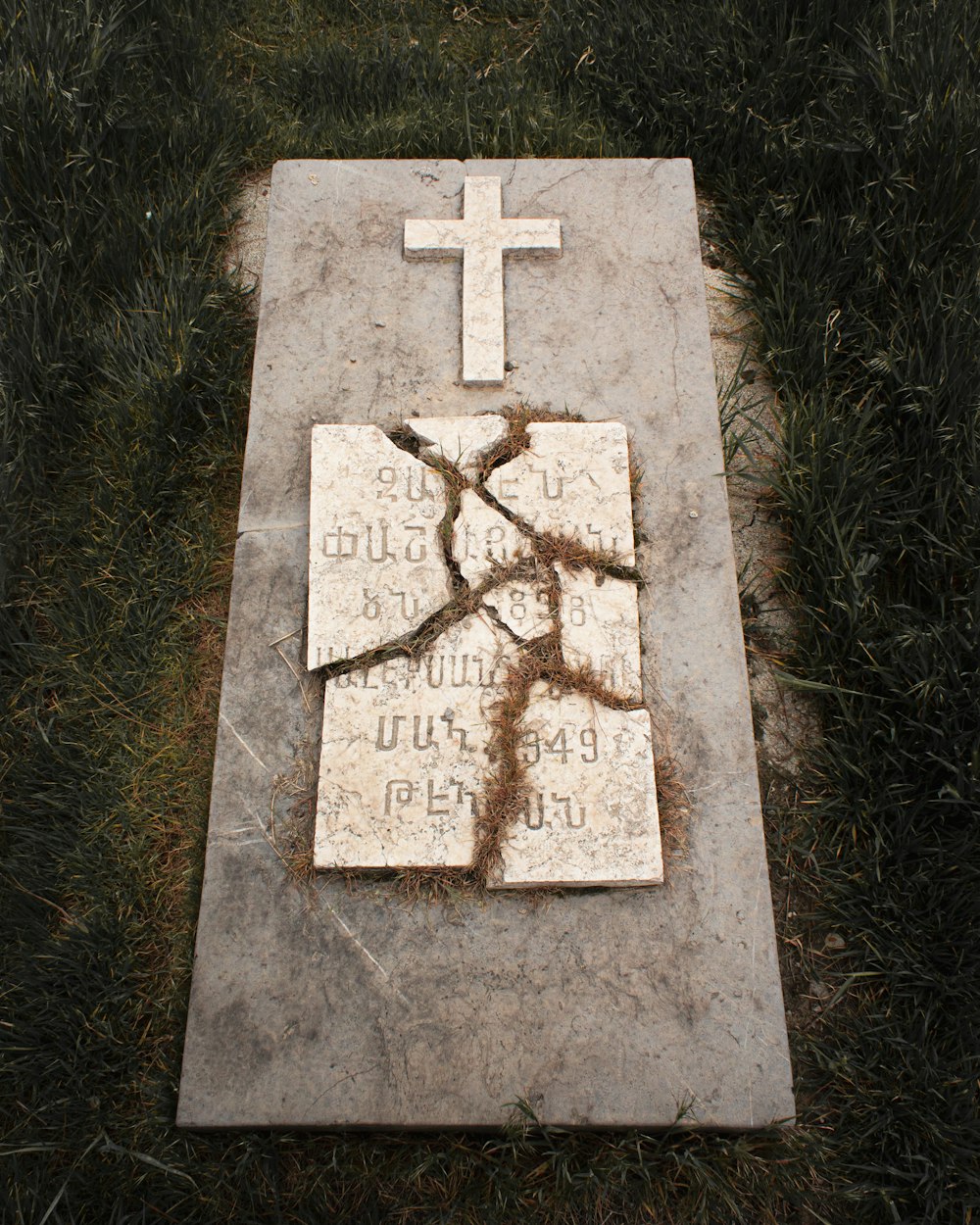 brown cross on green grass