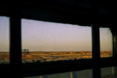 Open living room with large windows overlooking the desert.