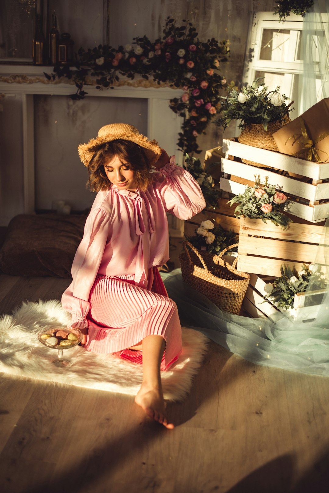 woman in pink and white dress sitting on brown wooden bench