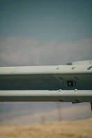 A detailed view of a PRFV pultruded guardrail installed along a busy urban passadiço