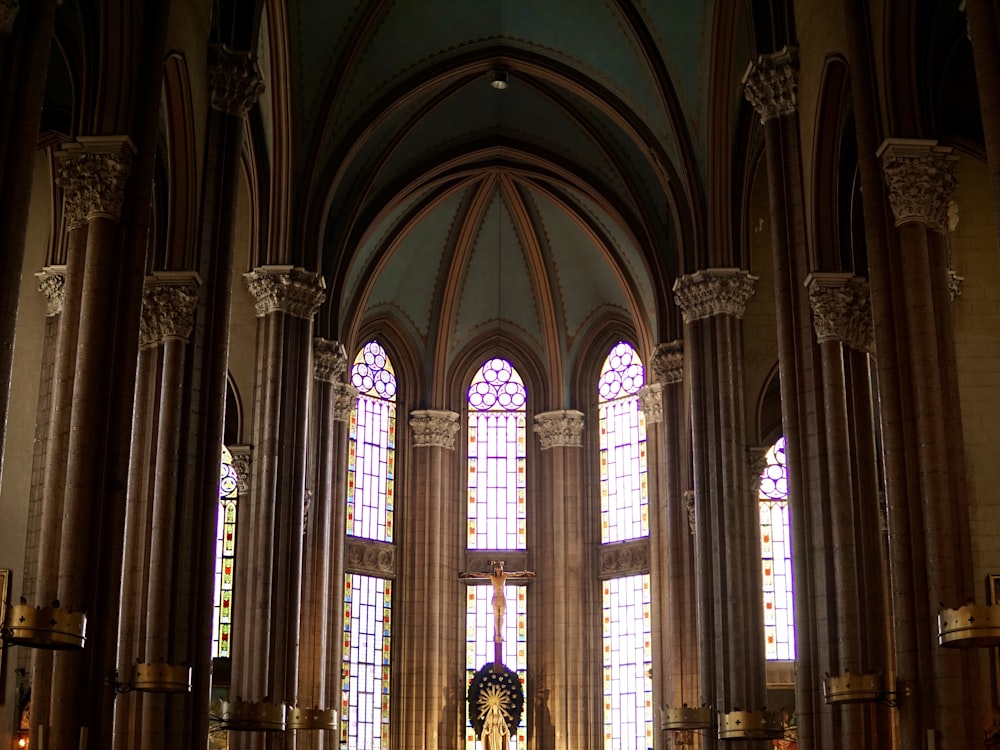 woman in black and white dress standing inside cathedral