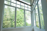 Office window featuring sliding panes for easy ventilation in a spacious room
