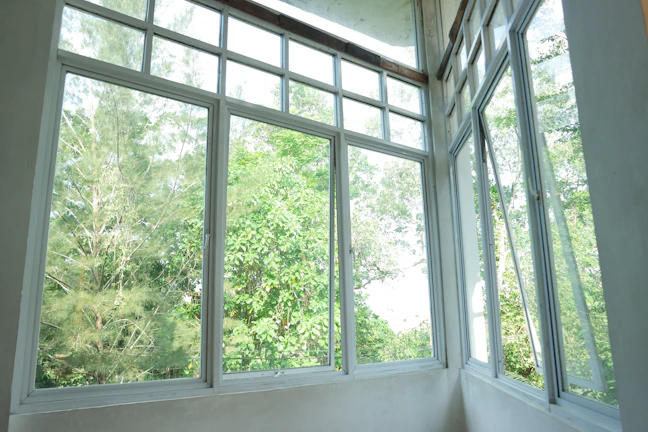 Office window featuring sliding panes for easy ventilation in a spacious room