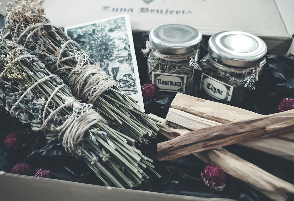 brown wooden sticks on clear glass jar