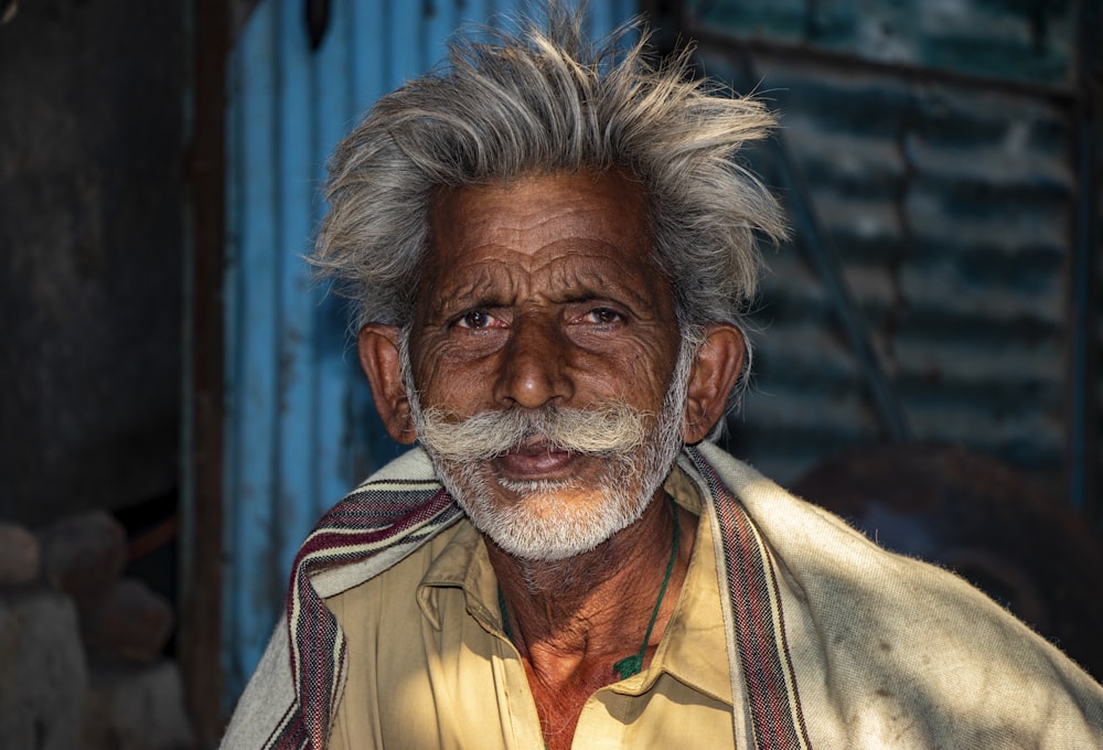 man in brown and white shirt