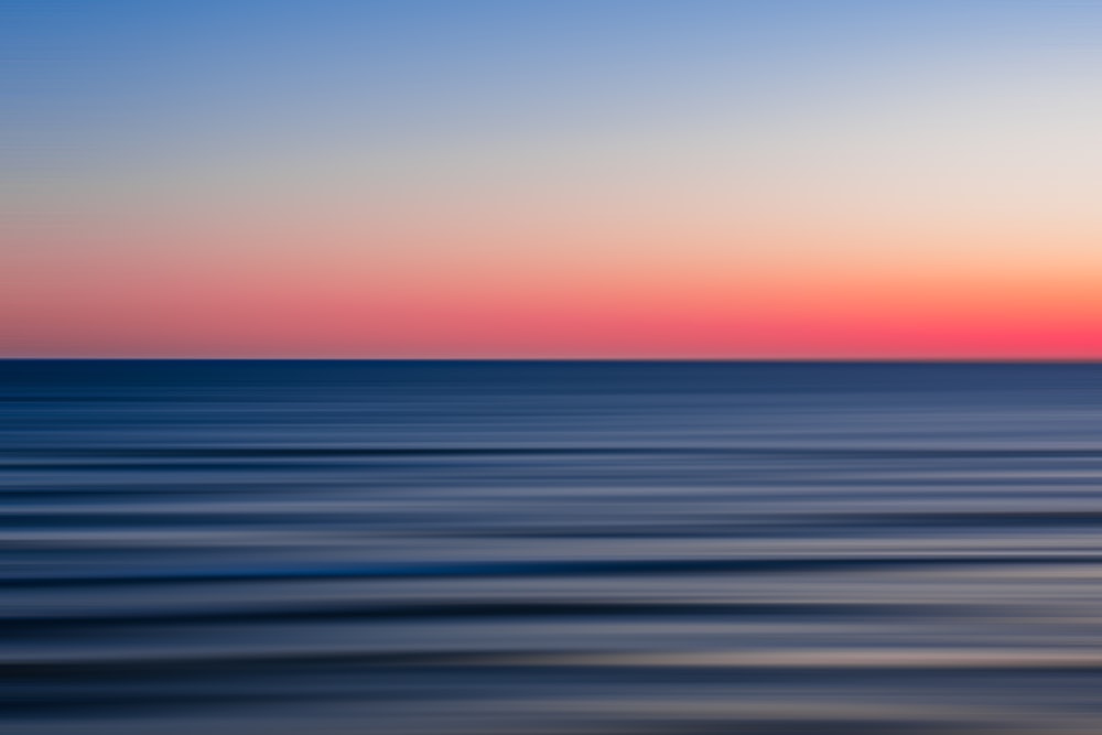 body of water during sunset