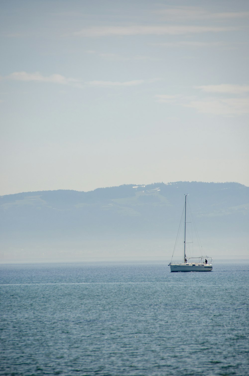 white sailboat on sea during daytime