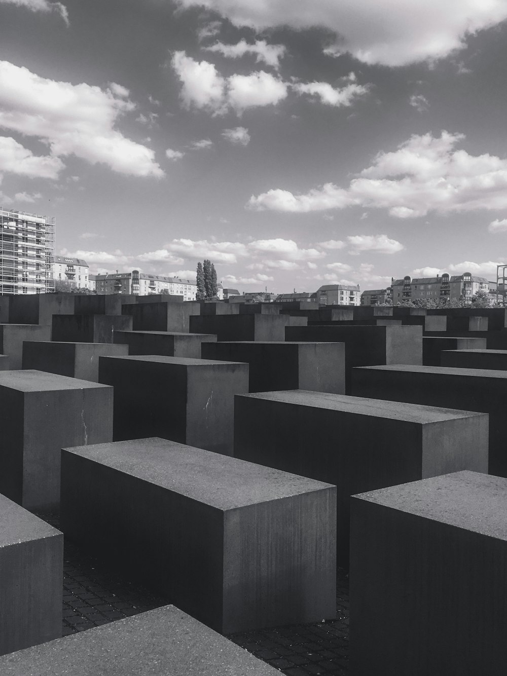 gray concrete blocks under cloudy sky during daytime