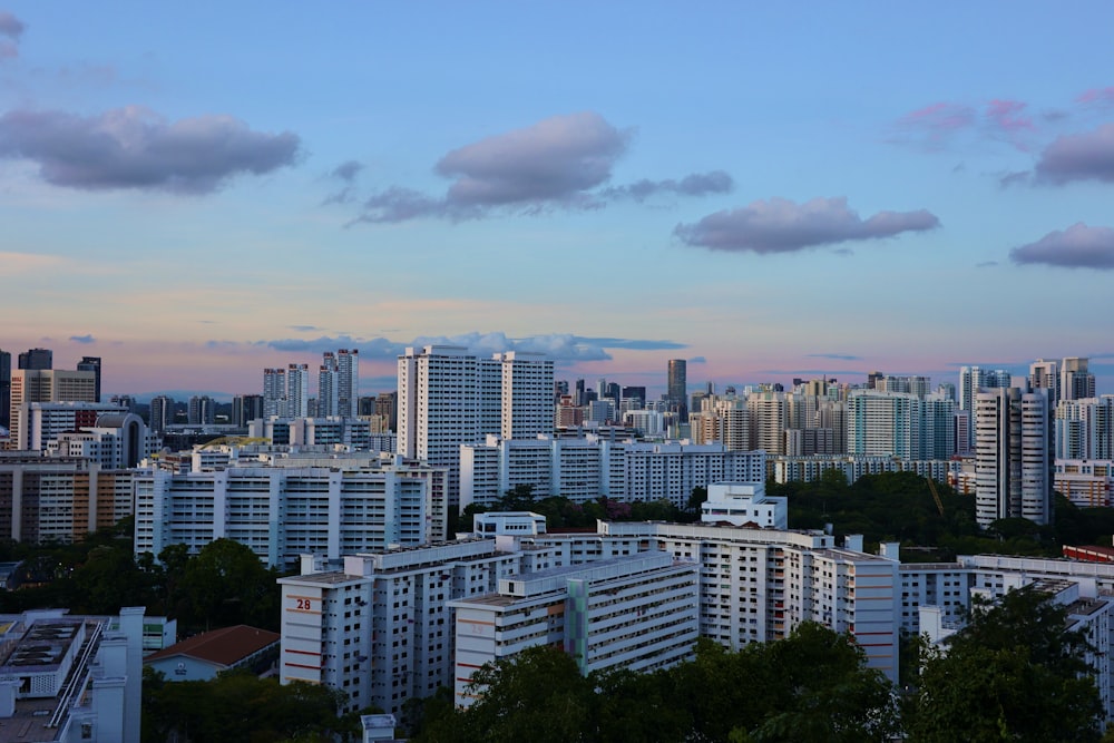 city skyline under cloudy sky during daytime