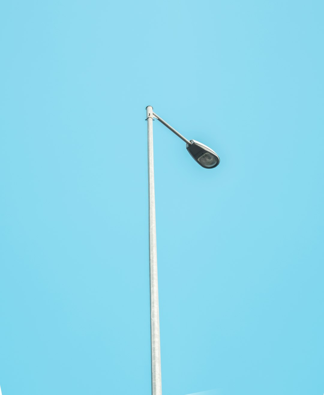 black street light under blue sky during daytime