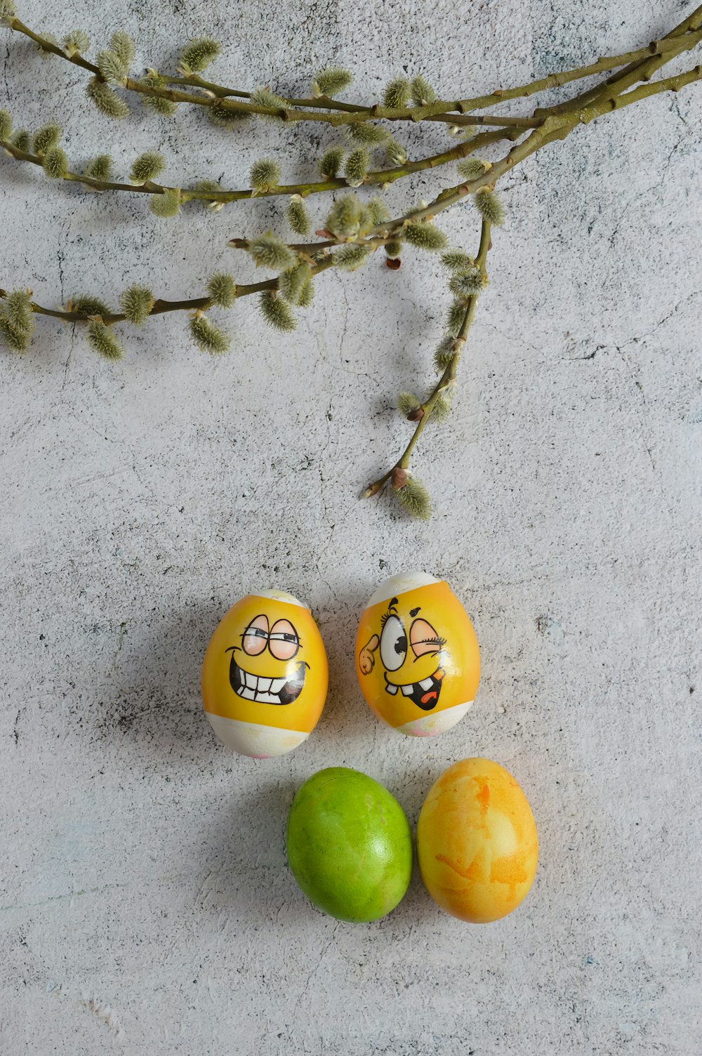 a couple of eggs with faces painted on them
