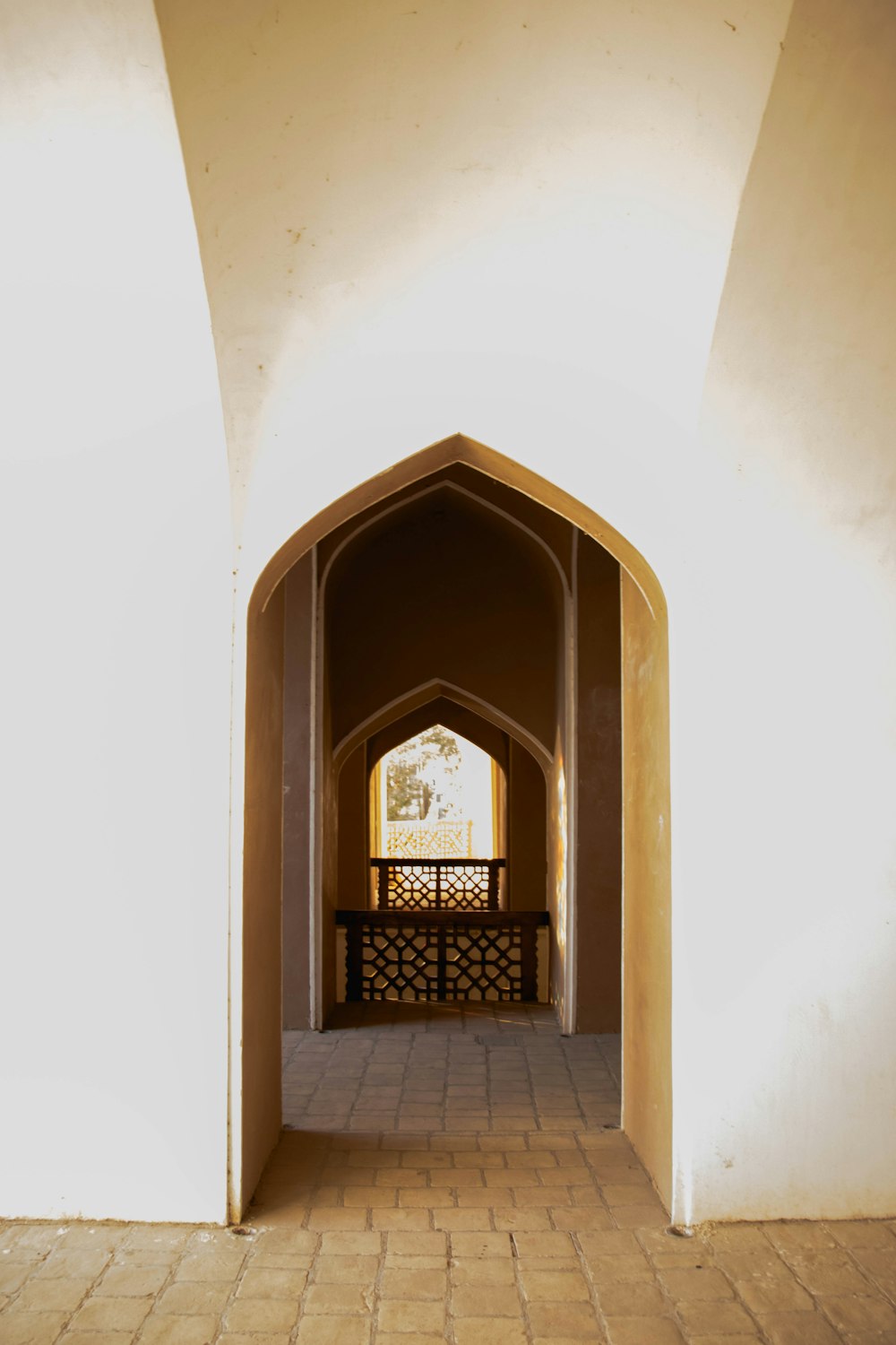 brown wooden door on white concrete building