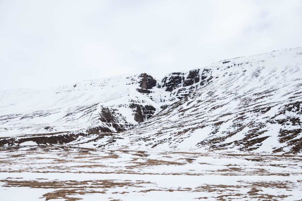 snow covered mountain during daytime