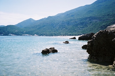 A peaceful Mediterranean coastline in Malta under a bright blue sky, inviting travelers.