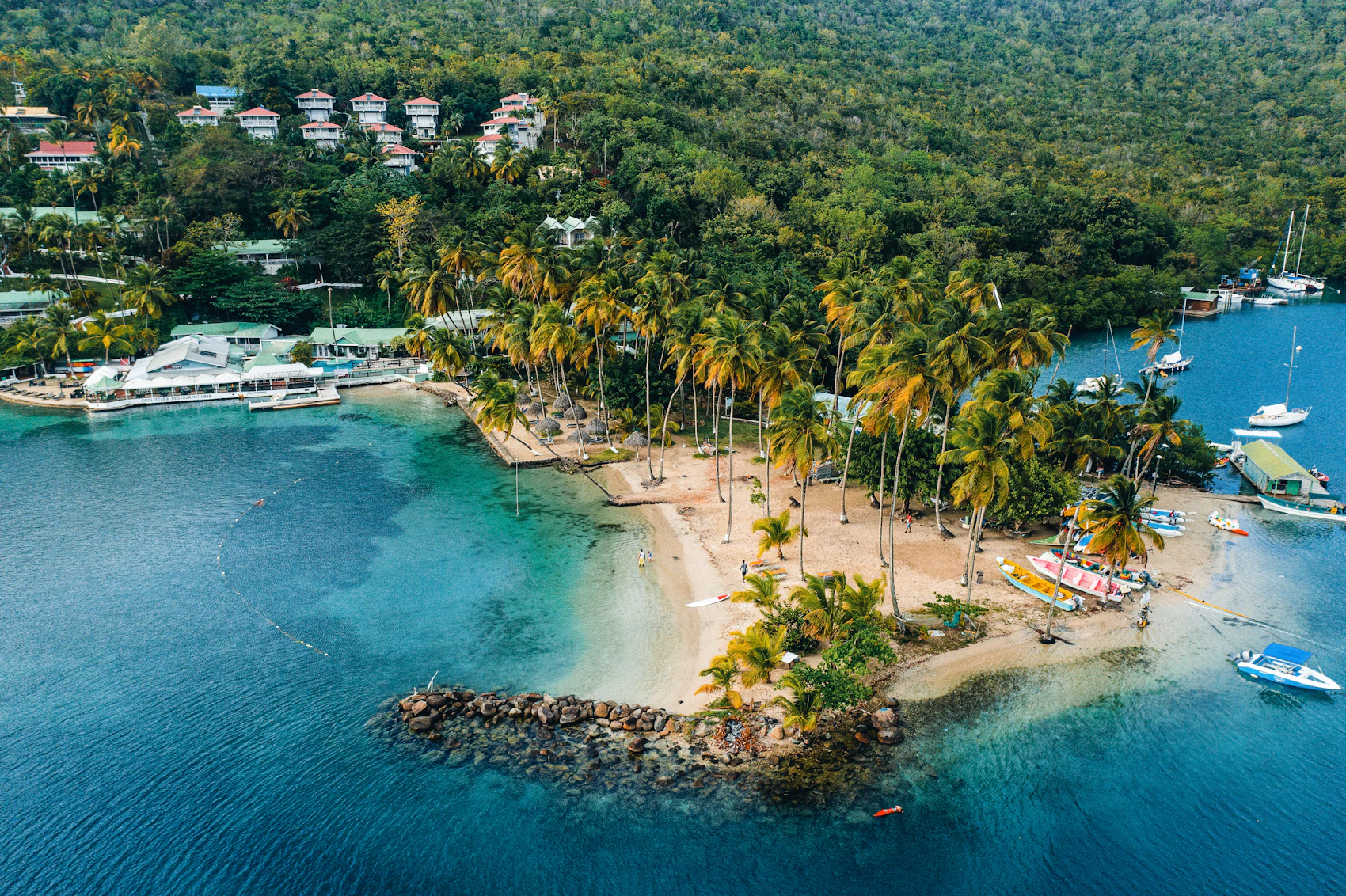 Palm-lined shores and boats seen from above at Marigot Bay, Saint Lucia