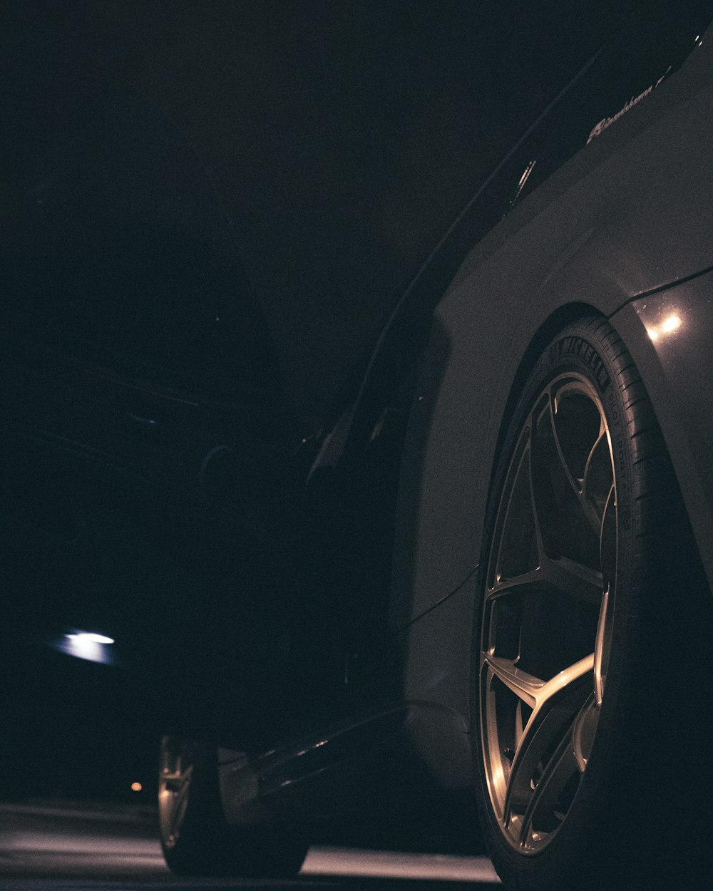 black car on the road during night time