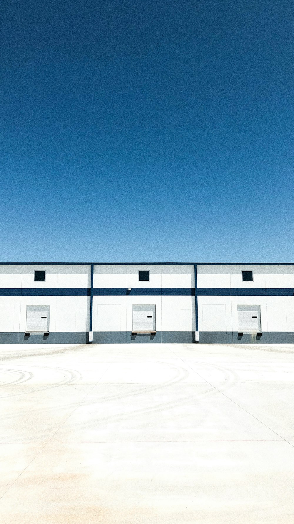 white concrete building under blue sky during daytime