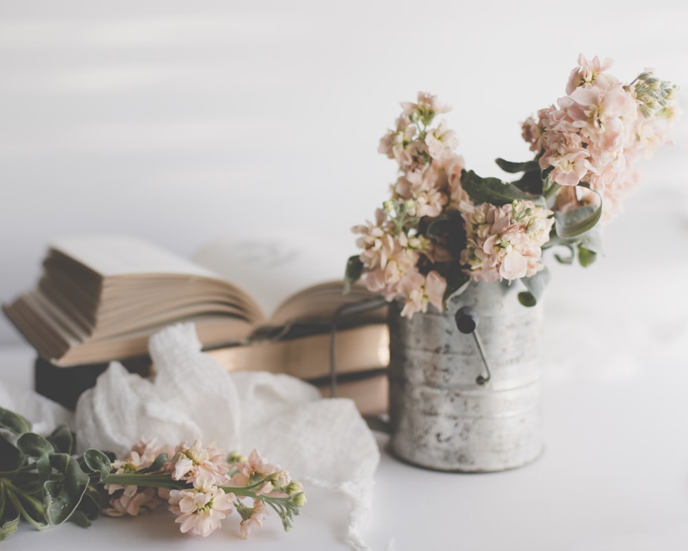 white flowers in white ceramic vase