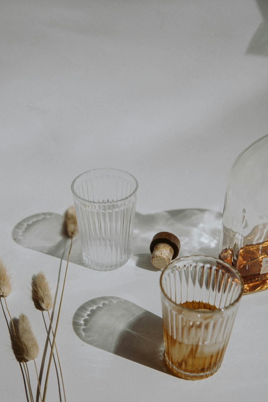 clear drinking glass on white table cloth