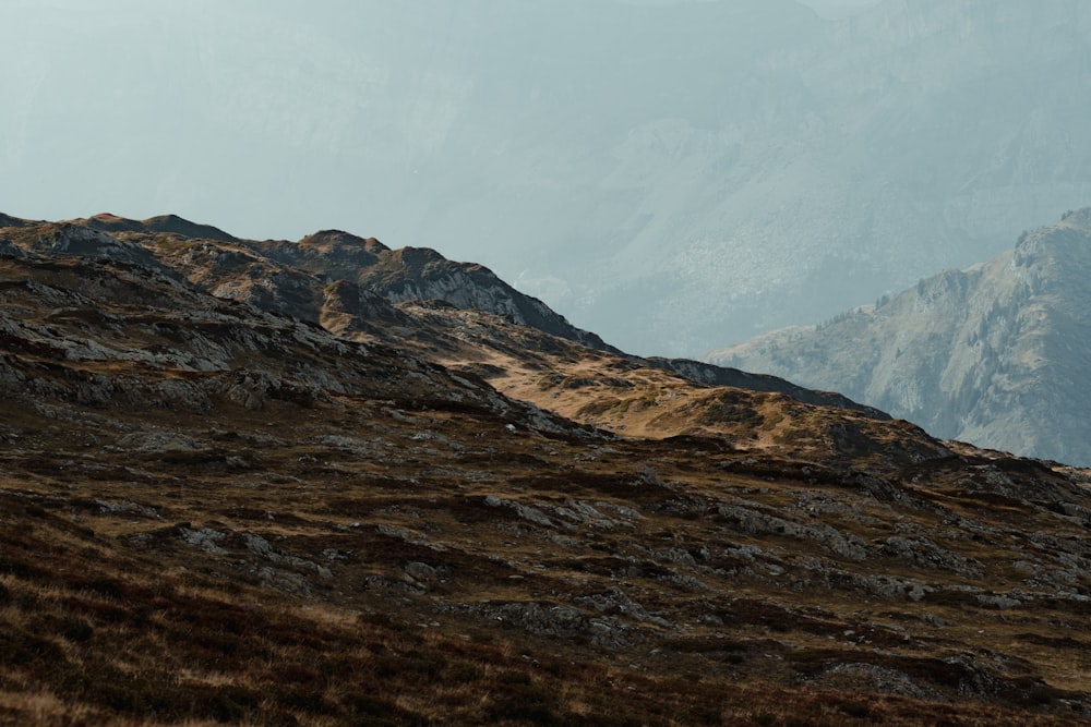 brown and white mountains under white sky during daytime