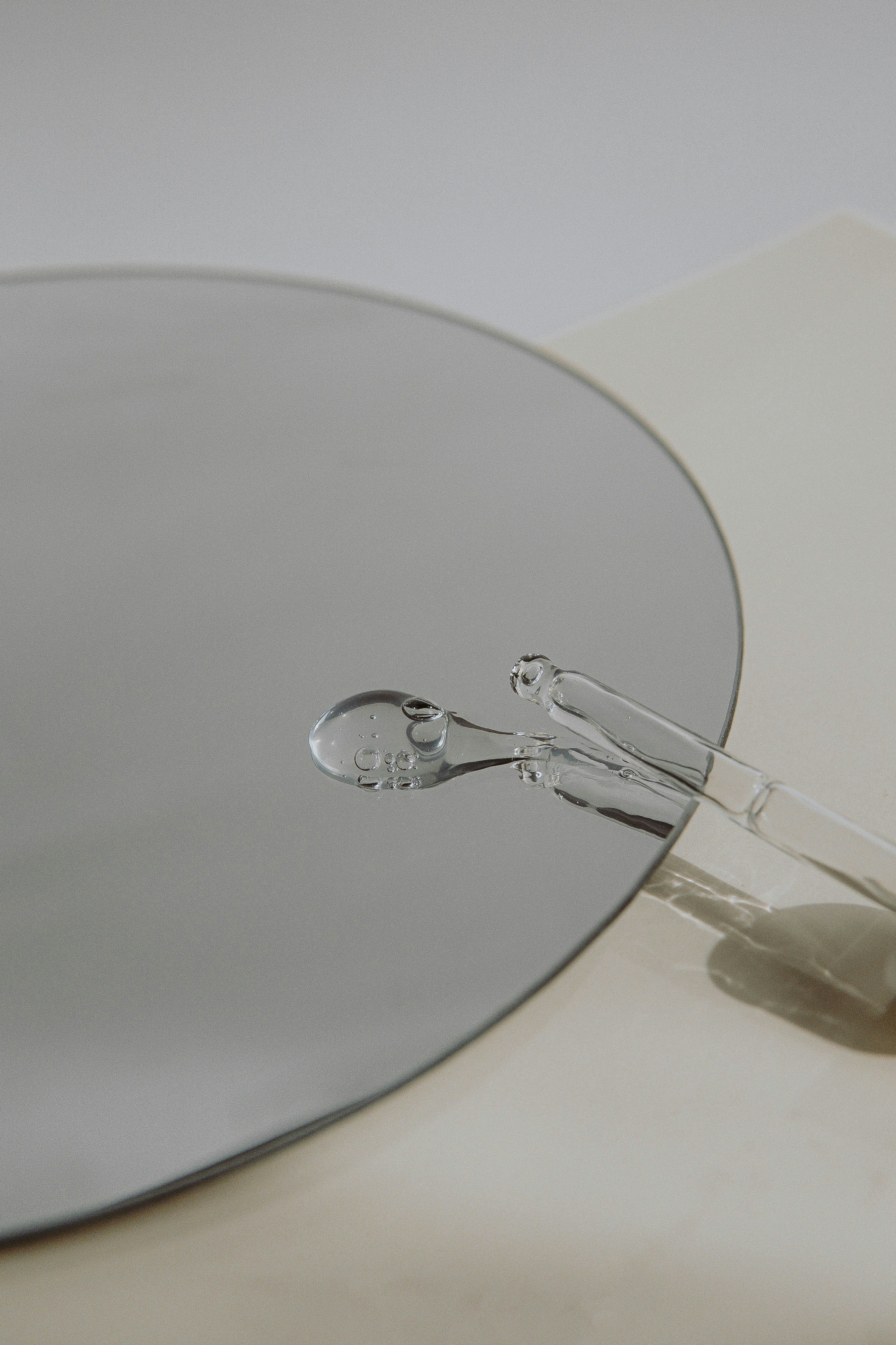 silver framed eyeglasses on white table