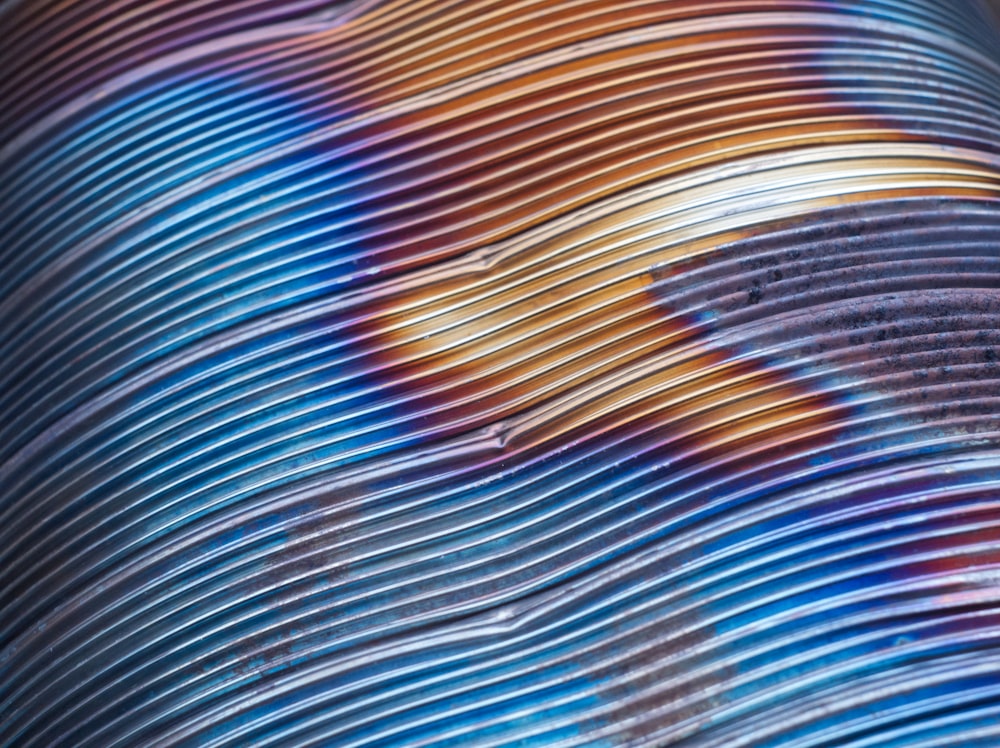 blue orange and yellow striped textile