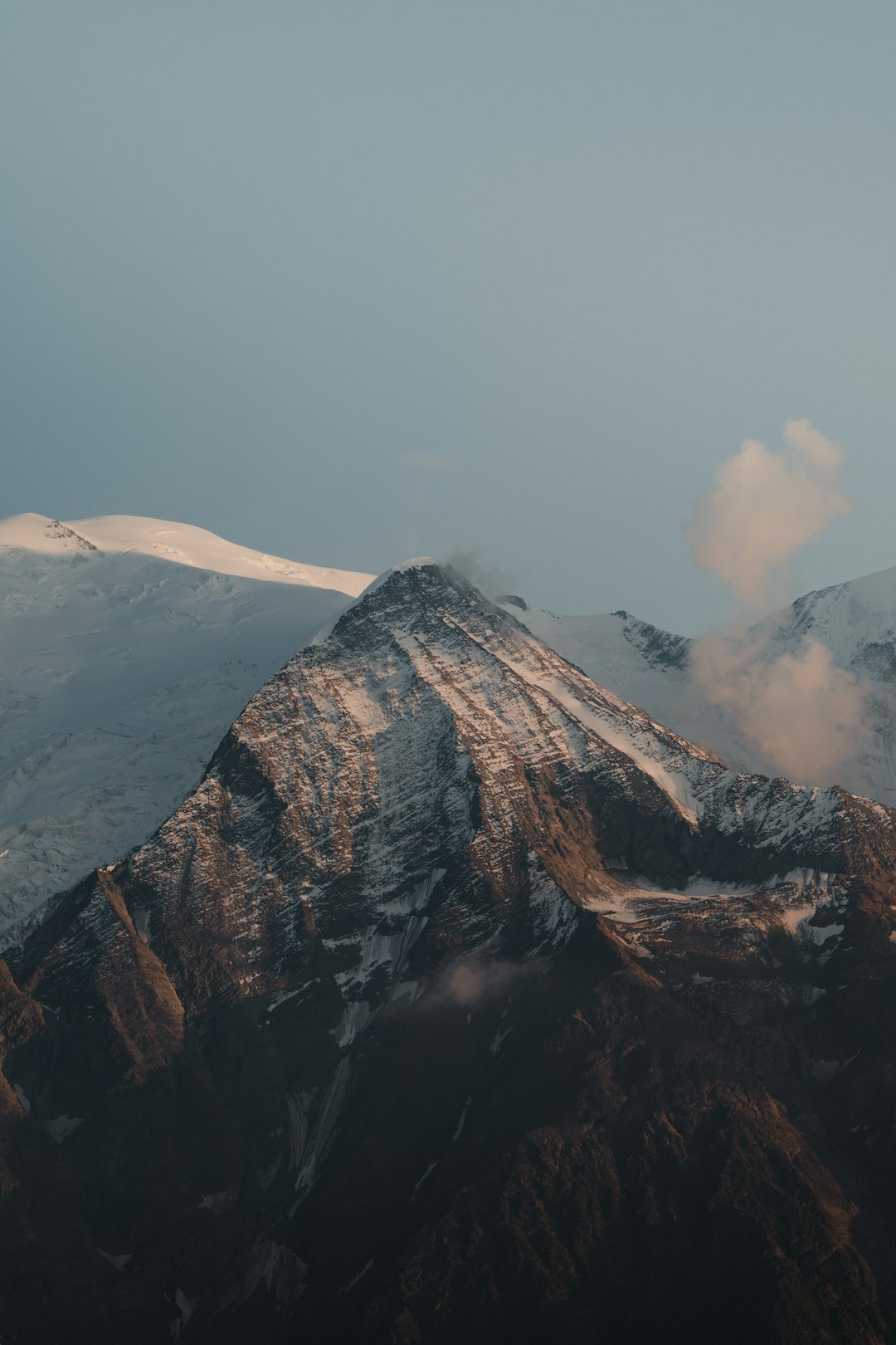 snow covered mountain under blue sky during daytime