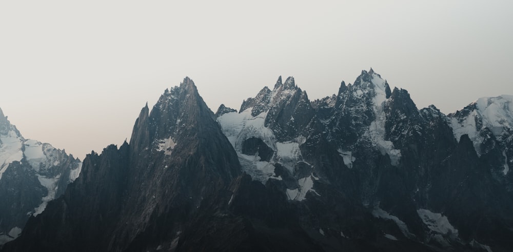 gray rocky mountain under white sky during daytime