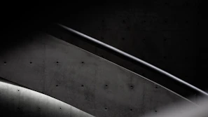 Close-up of a PRFV staircase with anti-slip surface and sturdy handrails in an industrial setting.