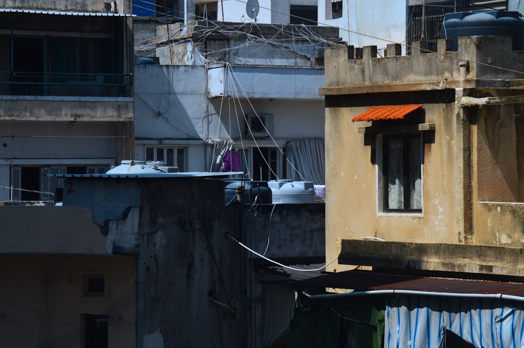 white car parked beside house during daytime