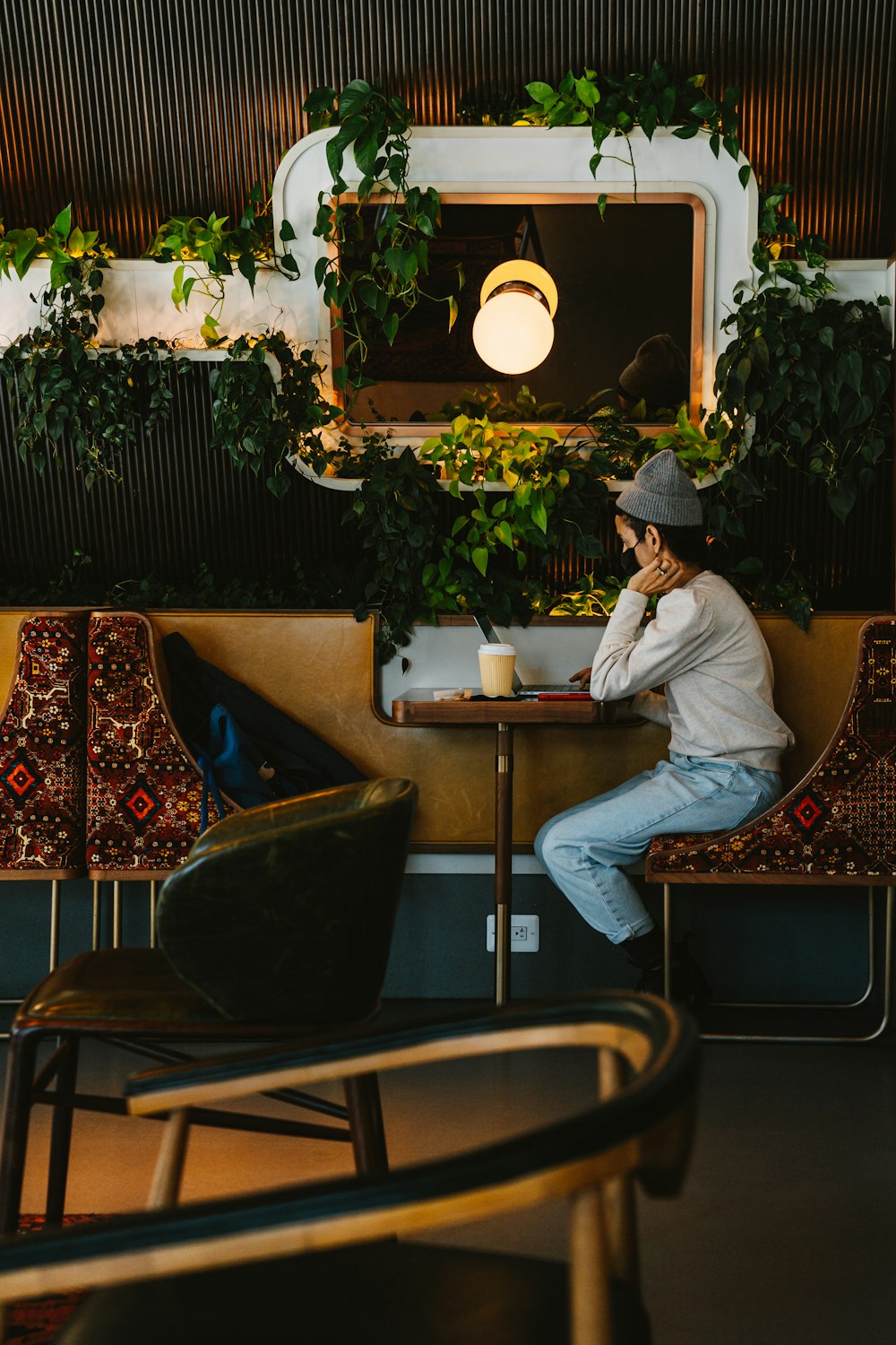 man in white thobe sitting on chair