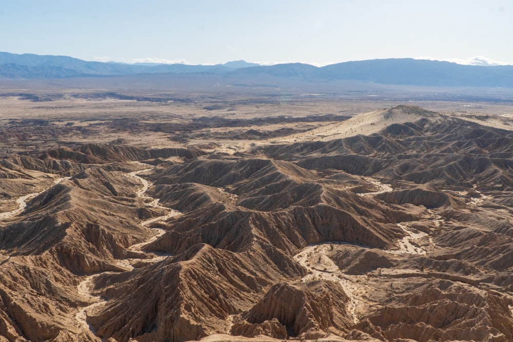 brown and black mountains under blue sky during daytime