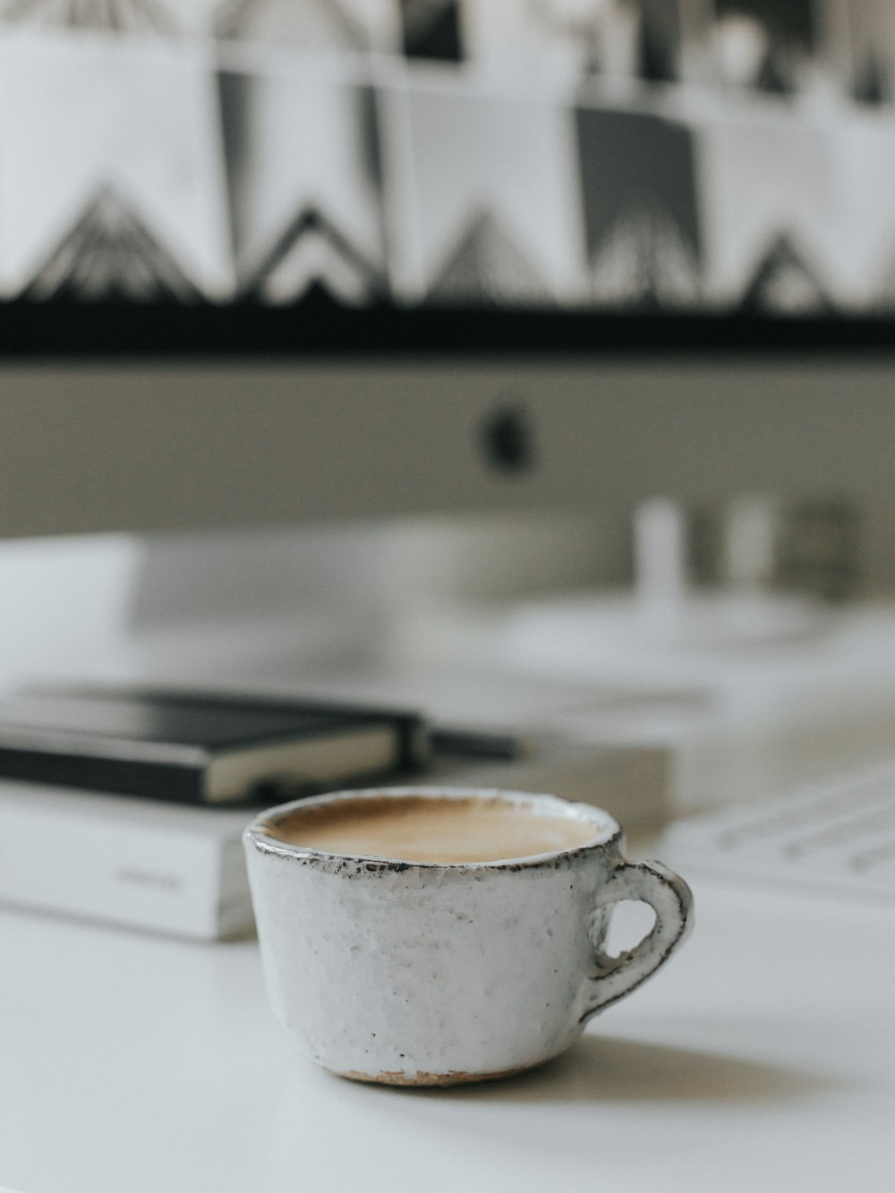 white ceramic mug on white paper