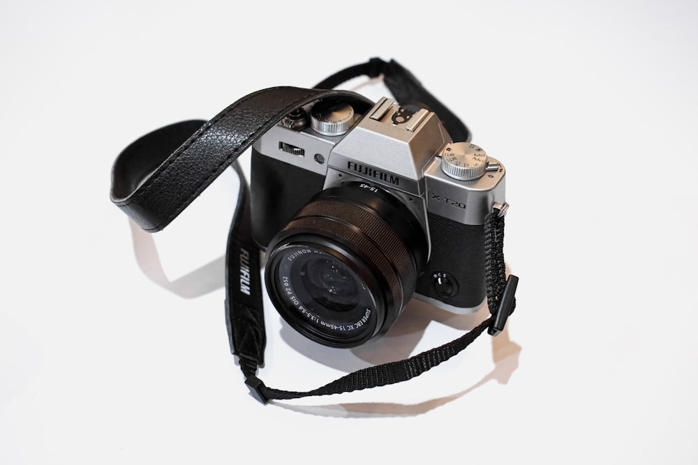 black and silver canon dslr camera