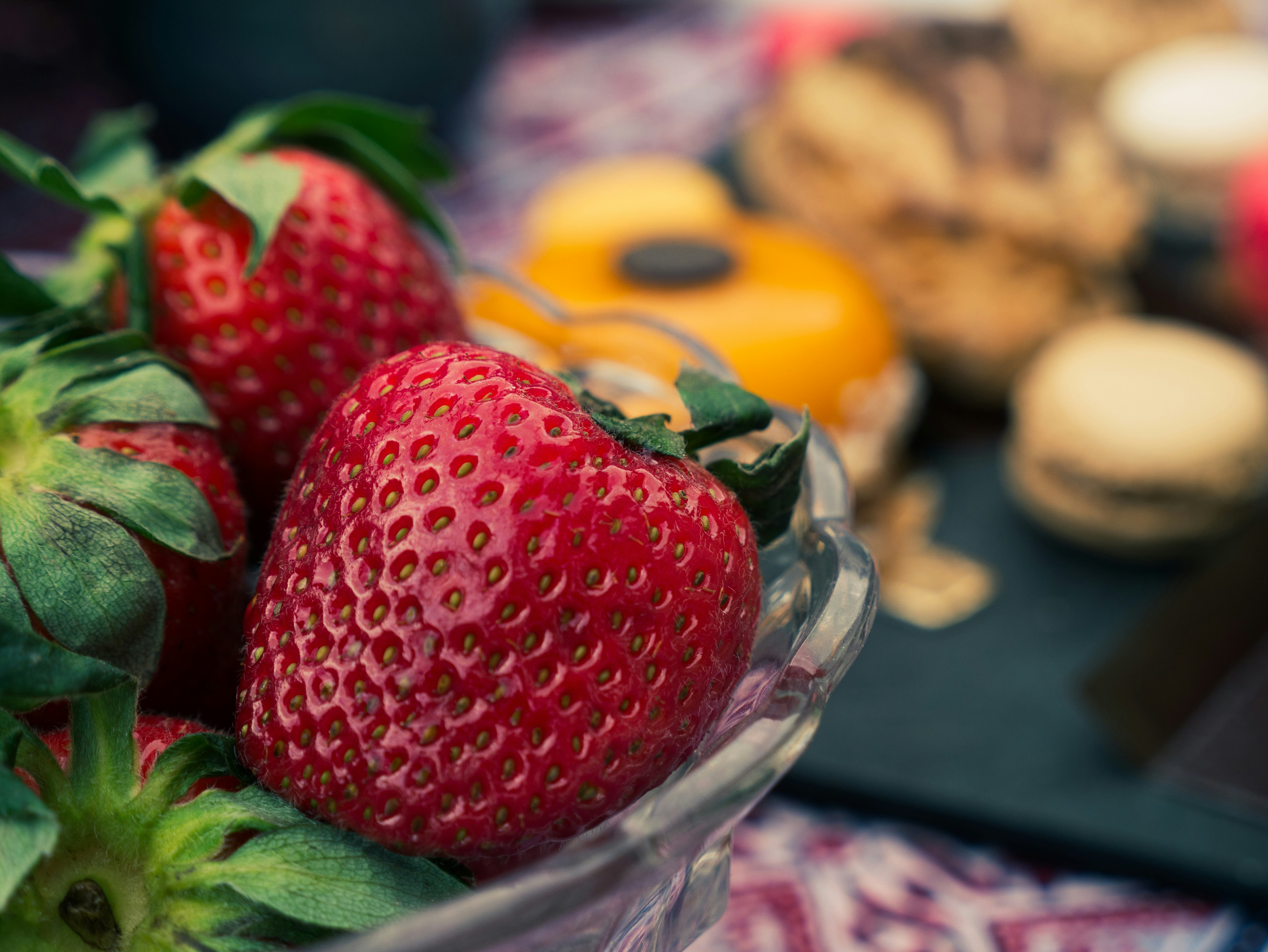 strawberries in clear glass bowl