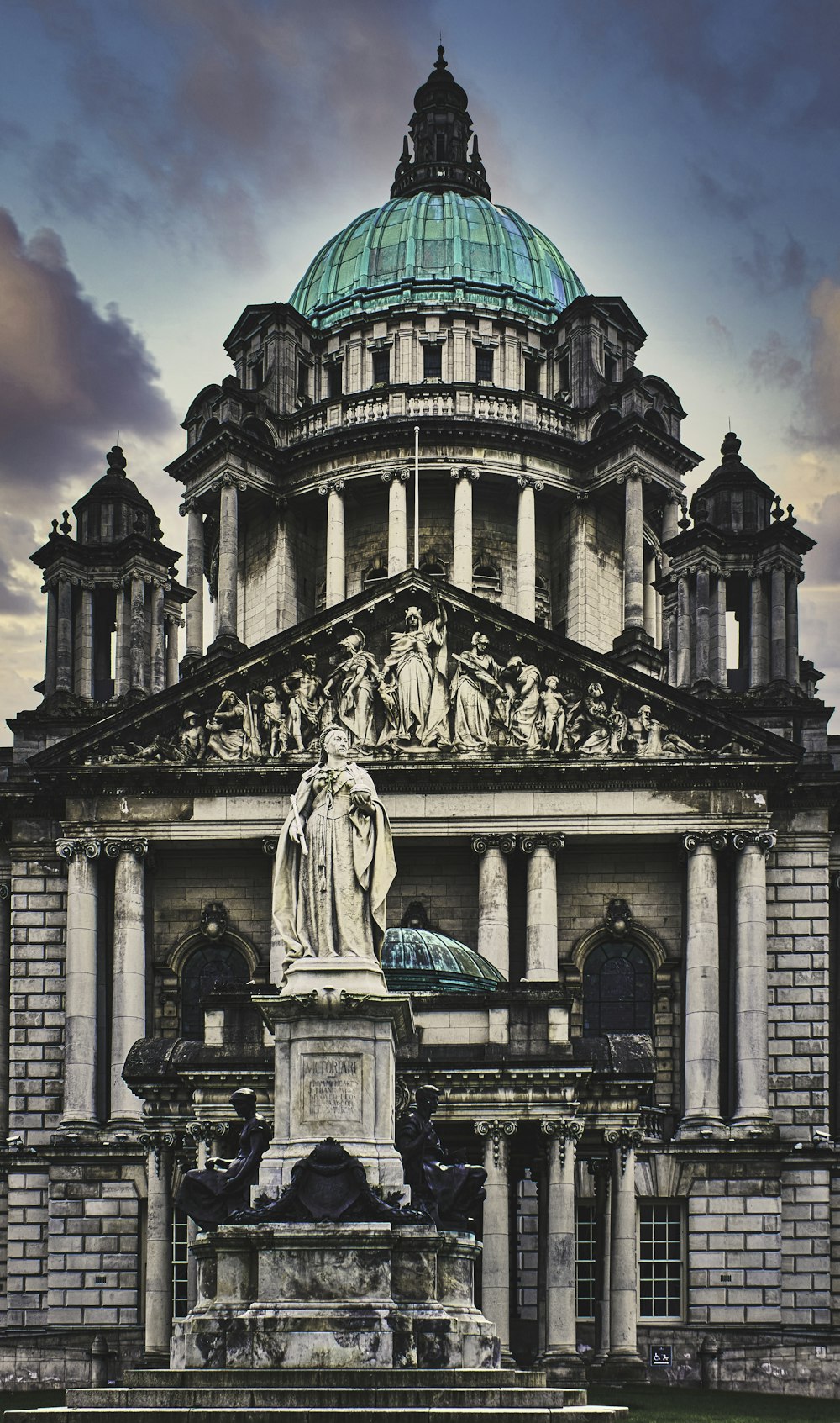 statue of man in front of building