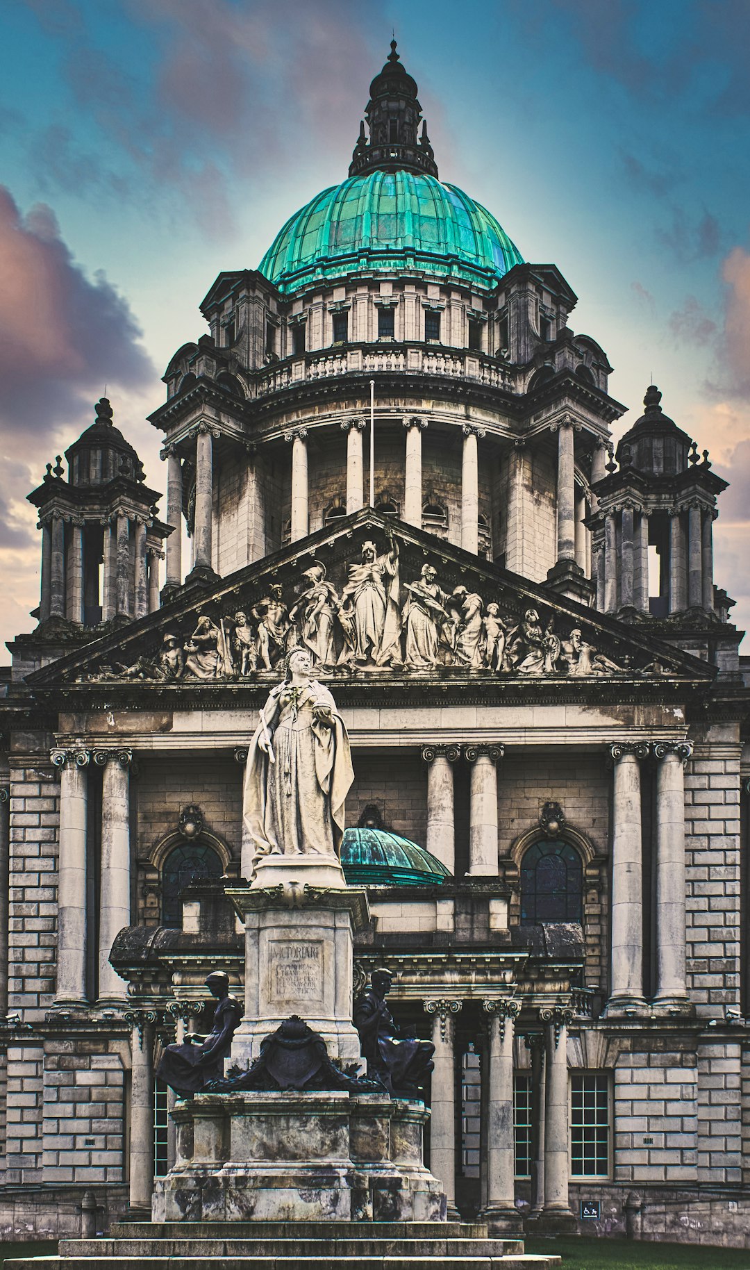 statue of man in front of building