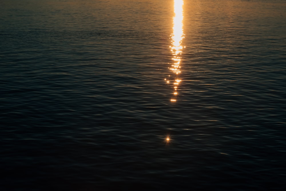 body of water during sunset