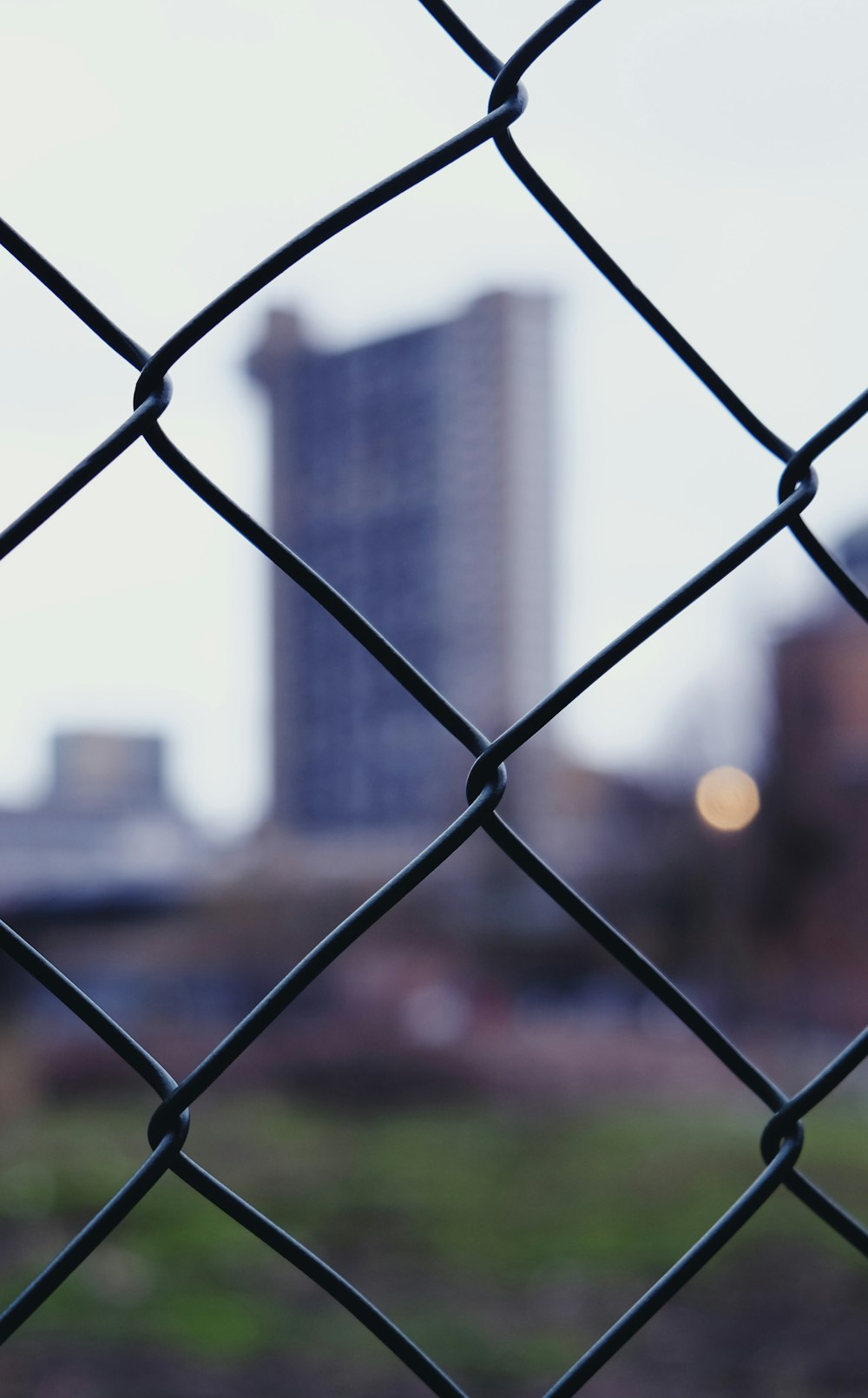 grey metal fence during daytime