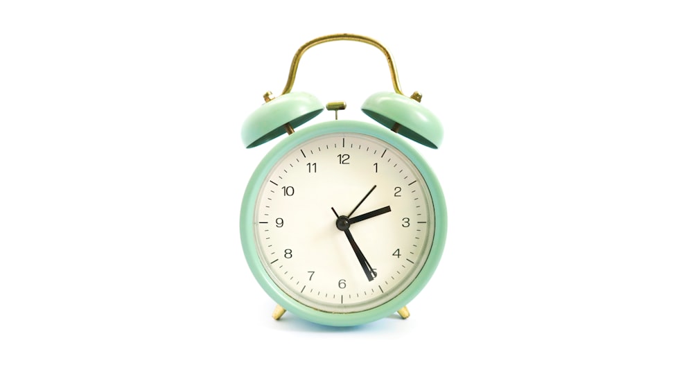 green and white alarm clock