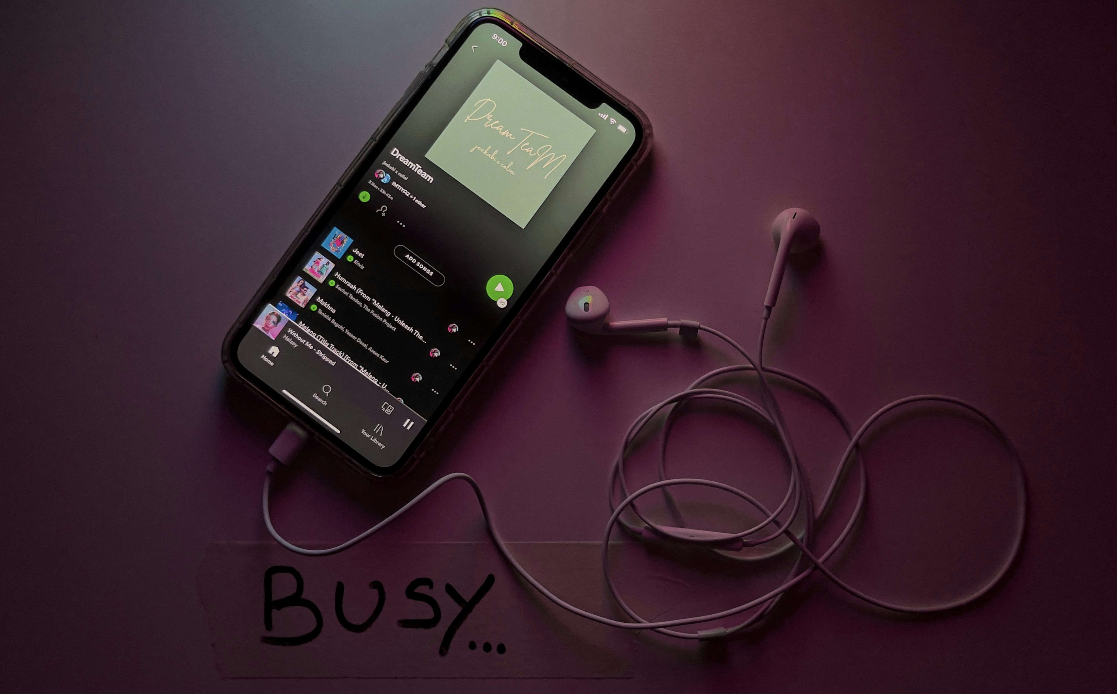 Apple Music interface displaying spatial audio track with headphones