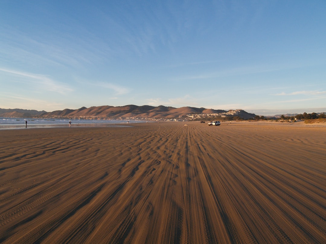 brown sand under blue sky during daytime