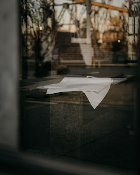 Neuropsychological assessment report laid out on a clean desk with calming beige background.
