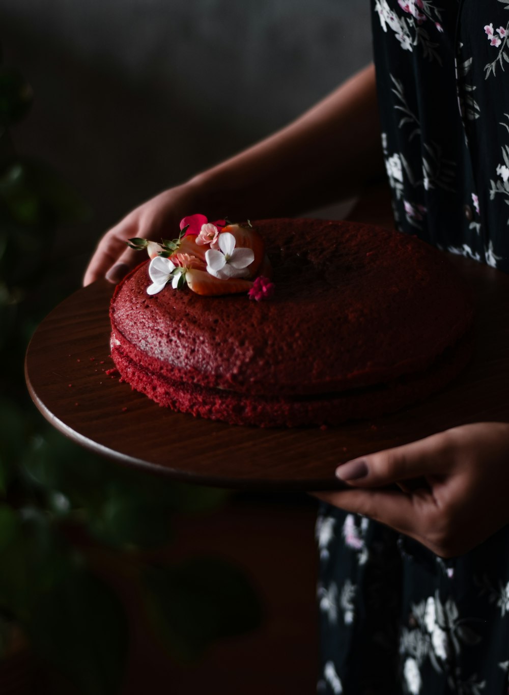 pink and white cake on brown wooden table