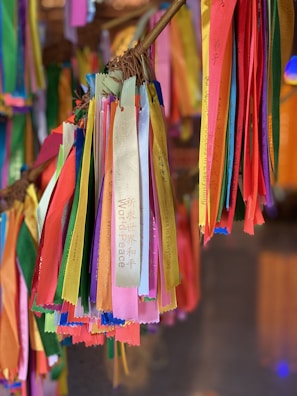 Colorful ribbons symbolizing hope and support displayed at a community gathering.