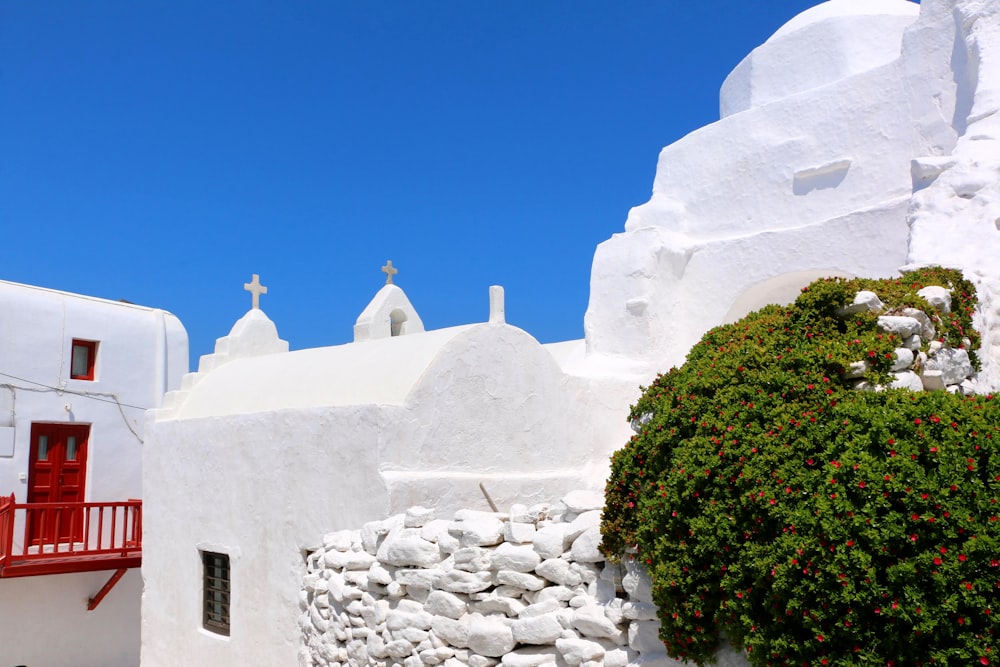 white concrete building near green trees during daytime